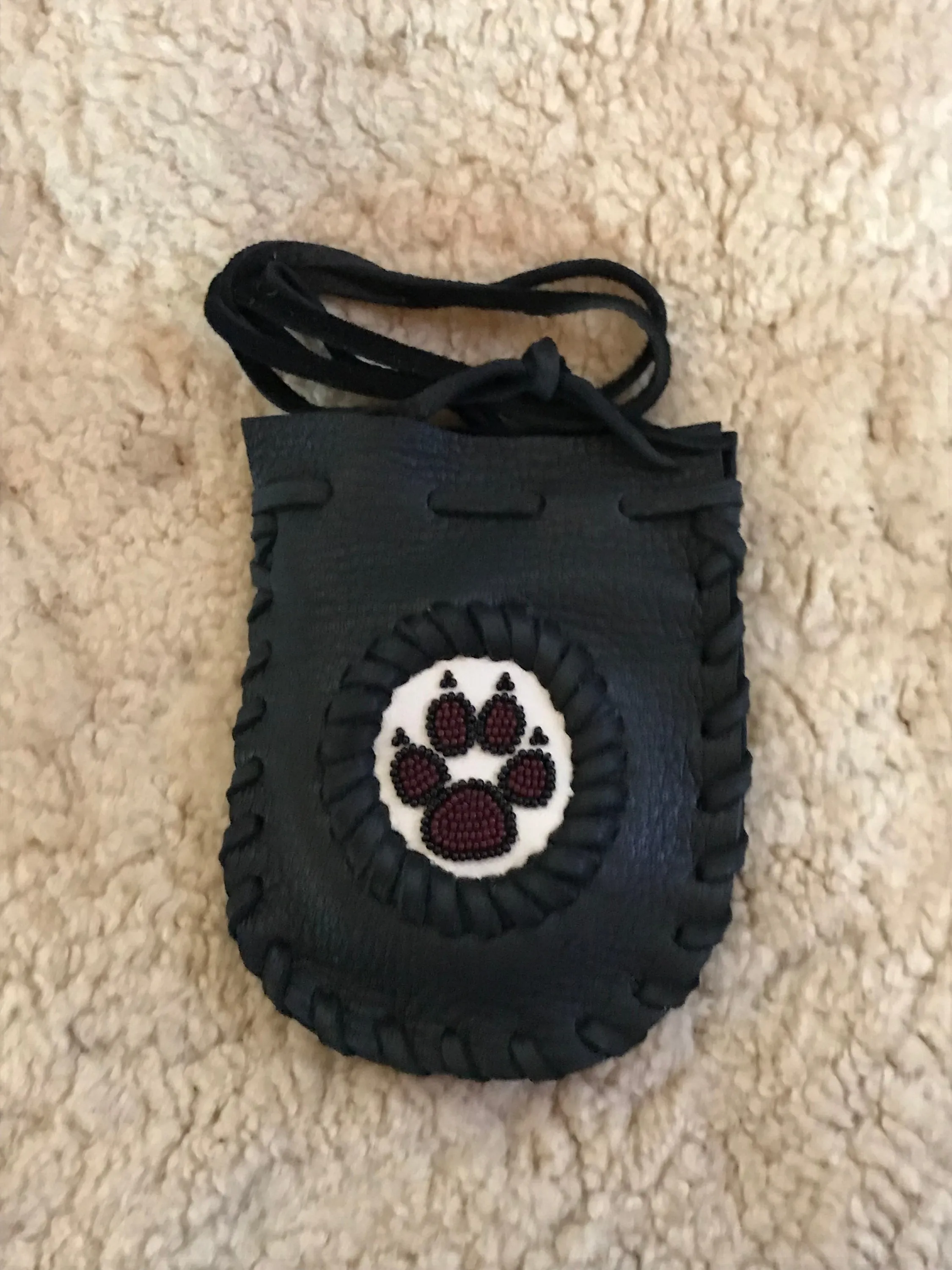 Black beaded wolf paw bag, beaded medicine bag