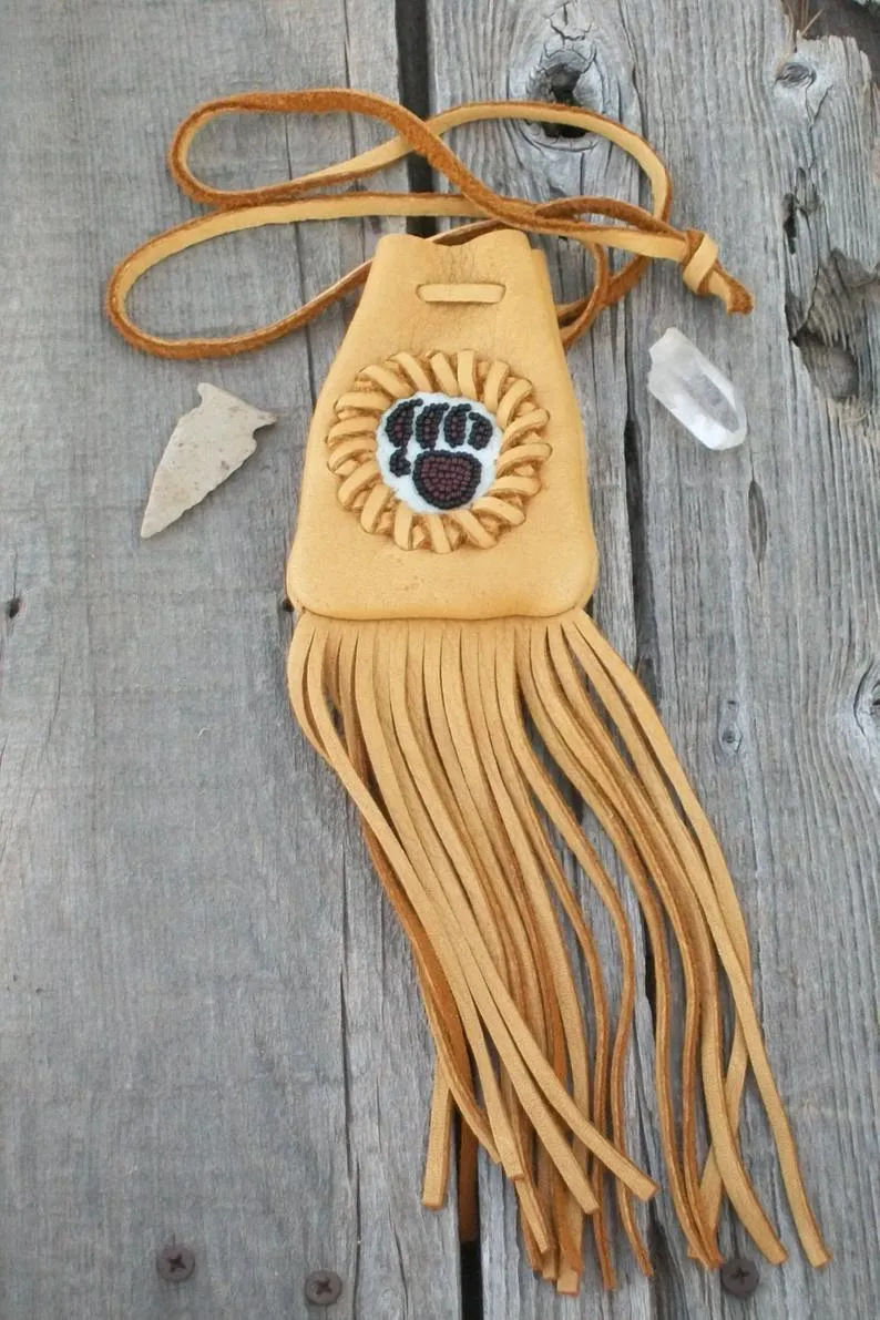 Fringed medicine bag with bear paw totem, leather neck pouch