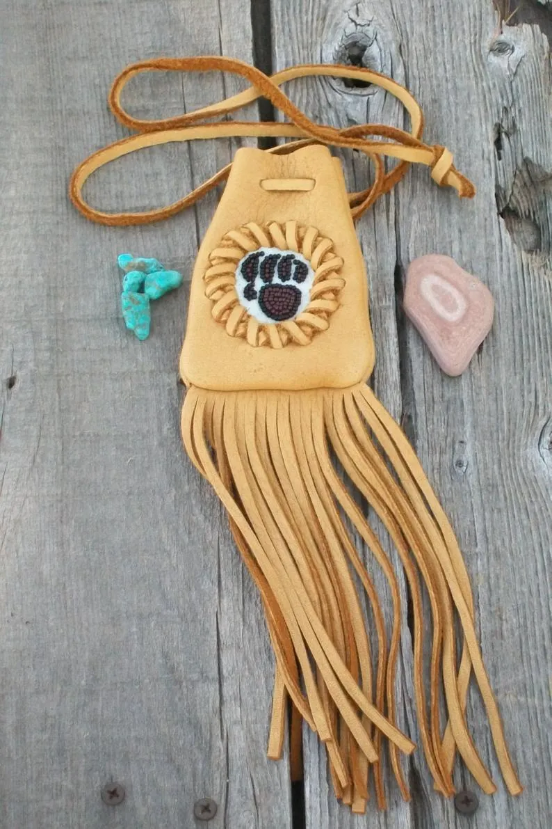 Fringed medicine bag with bear paw totem, leather neck pouch